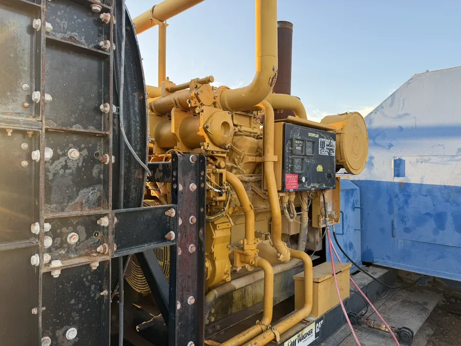 A Caterpillar 3508 engine at a saltwater disposal site.